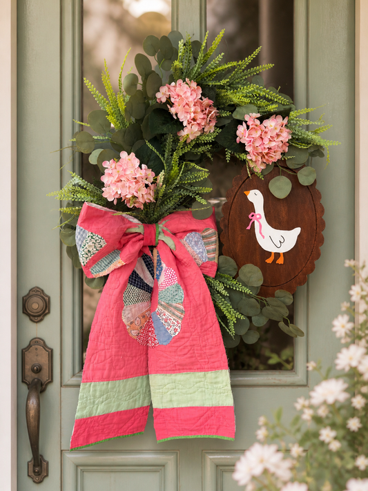 Bright pink vintage quilted bow floral goose wreath